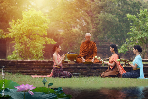 Offering alms to monks Is the merit of Buddhism On Lent Day at one of the old temples In Phra Nakhon Si Ayutthaya province, Thailand