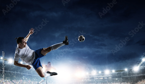 Soccer player in action on a stadium © Sergey Nivens