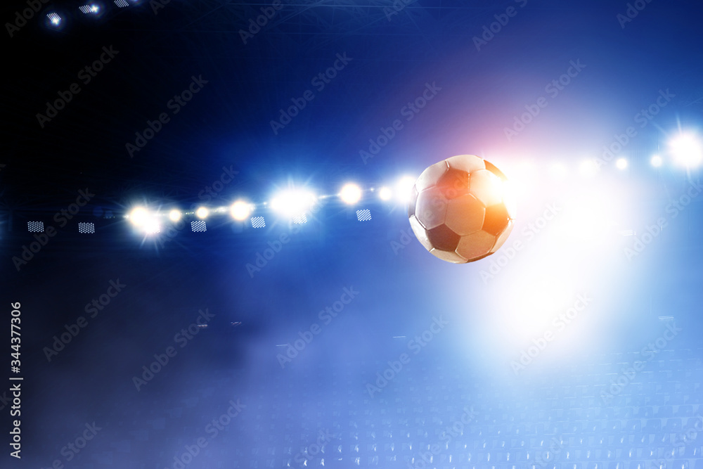 Naklejka premium Soccer ball flight over stadium