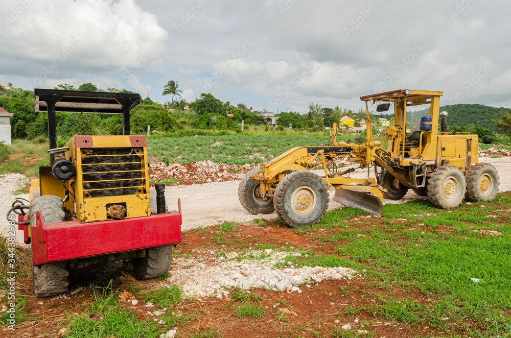 Obraz premium Grader And Roller-compactor On Construction Site