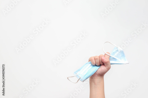 kid crumpled face mask in hand  on white background