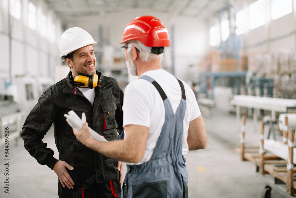 Colleagues working together. Workers in factory. Colleagues working together. Workers in factory.