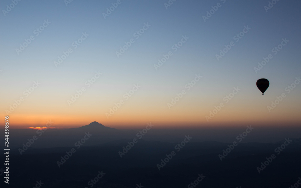 Hot Air balloon flying in Turkey Goreme Capadocia sky sunset sunrise Hot Air balloon flying in Turkey Goreme Capadocia sky sunset sunrise