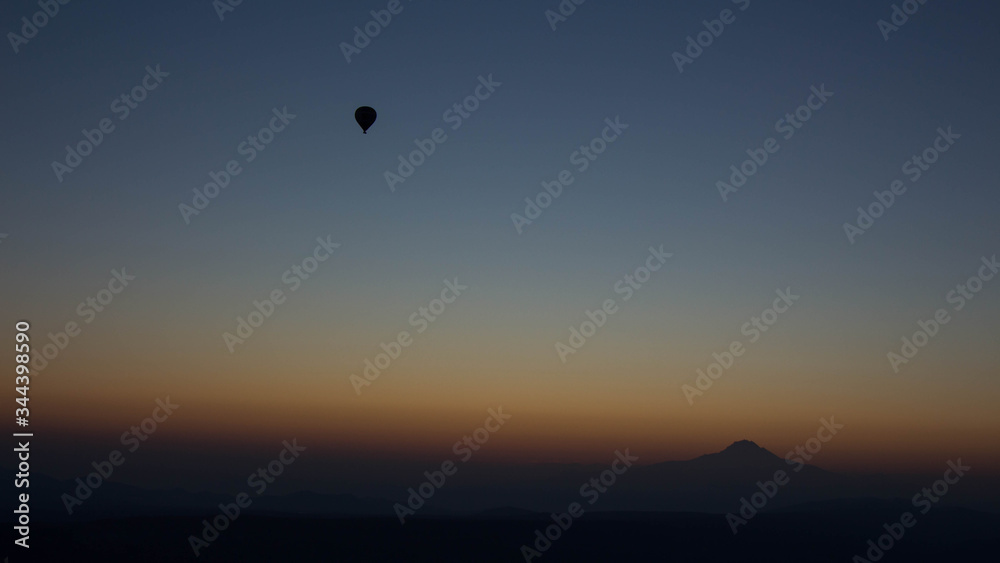 Hot Air balloon flying in Turkey Goreme Capadocia sky sunset sunrise