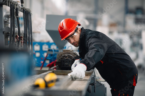 Portrait of worker in factory.	 photo