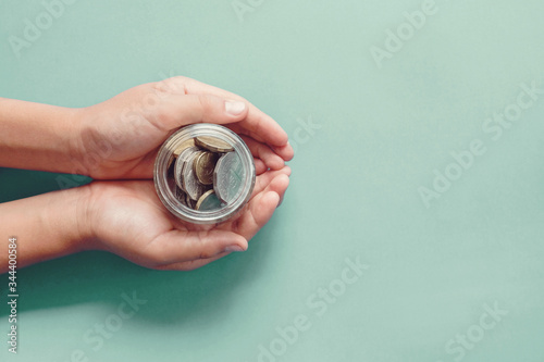 hands holding money jar, donation, saving, charity, family finance plan concept, Coronavirus economic stimulus rescue package, superannuation concept