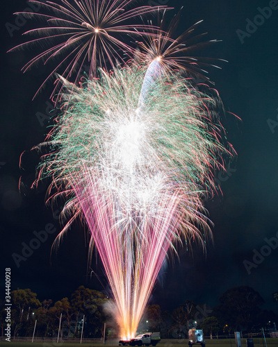 Fireworks at night purple and green