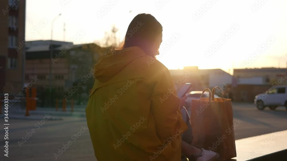The courier is waiting for an order on the street. The courier delivers food home. Quarantined food delivery. The courier is waiting for an order on the street. The courier delivers food home. Quarantined food delivery.