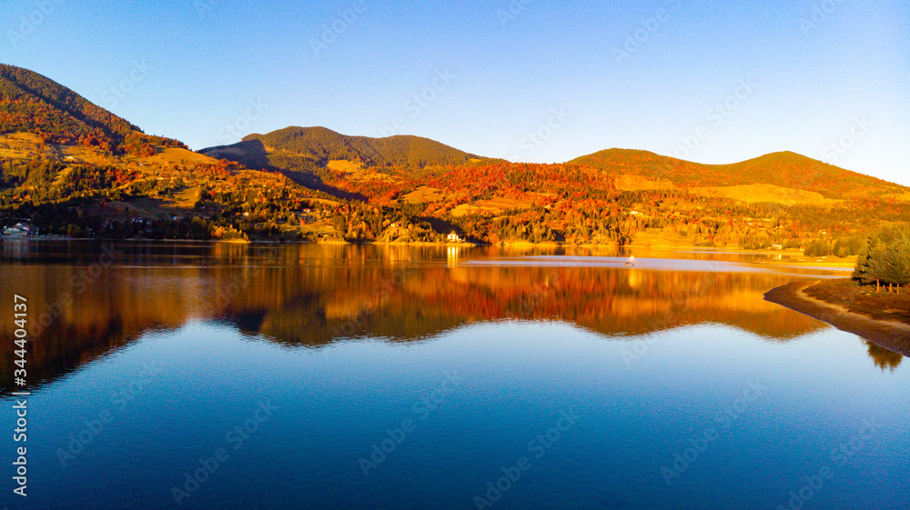 sunset on the lake and mountains in the background sunset on the lake and mountains in the background