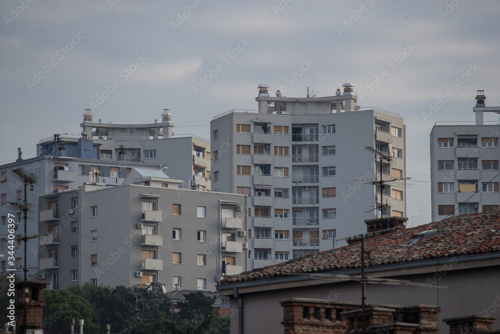 City blocks or condominiums packed together in a city of Rijeka, Croatia on a sunny autumn day. Socialistic cubical buildings.