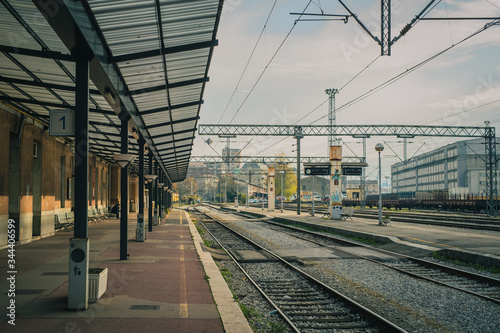 Deserted train station in Rijeka, croatia, in late autumn morning. No trains and people on the platforms on an old style train station.