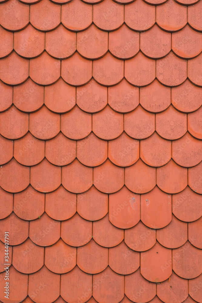 Red or orange roof tiles, looking directly from above. Good background of red roof tiles.