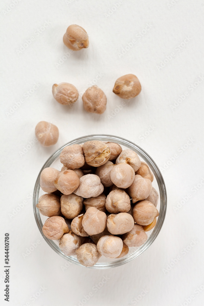 whole chickpeas in a plate on a white background whole chickpeas in a plate on a white background