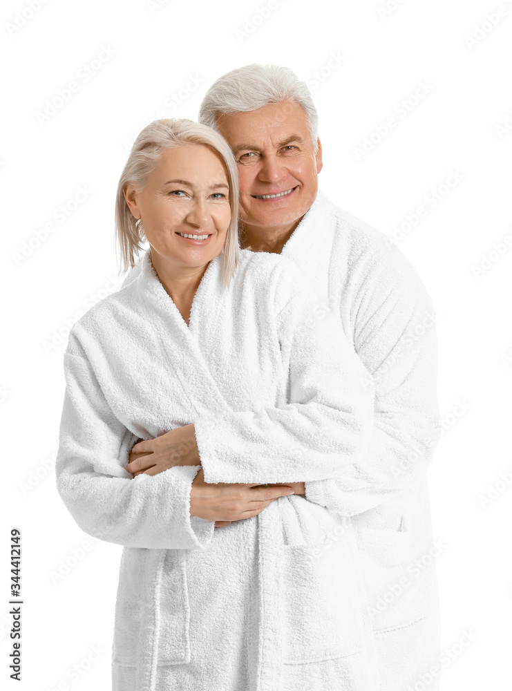Mature couple in bathrobes on white background Mature couple in bathrobes on white background