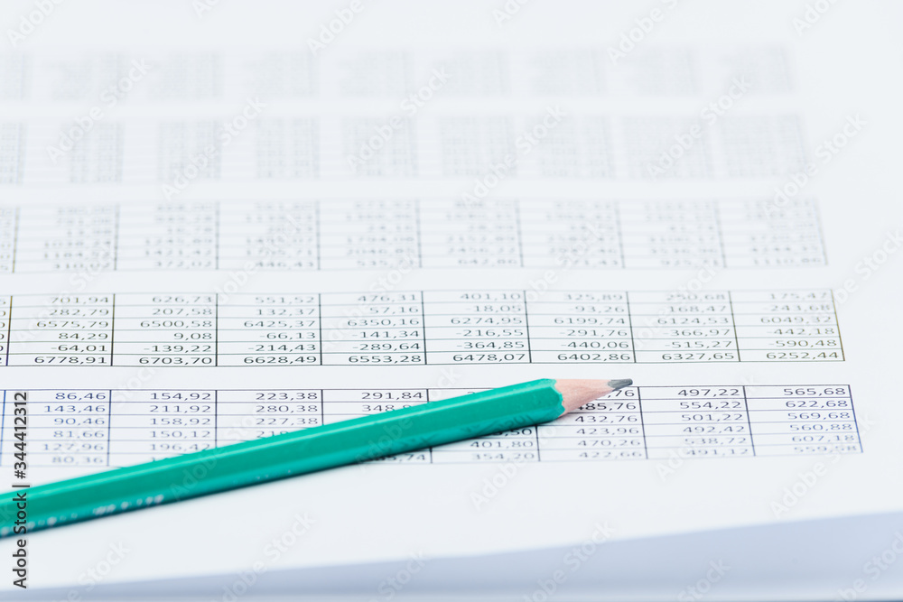 Business financial documents, office calculator and pen on the table. Numbers and graphs Business financial documents, office calculator and pen on the table. Numbers and graphs