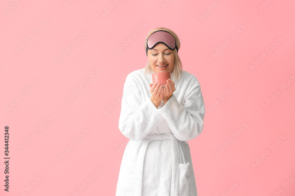 Fototapeta premium Happy Woman in Sleep Mask Holding Mug