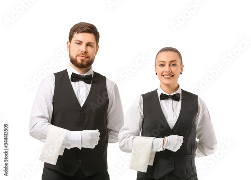 Male and female waiters on ...