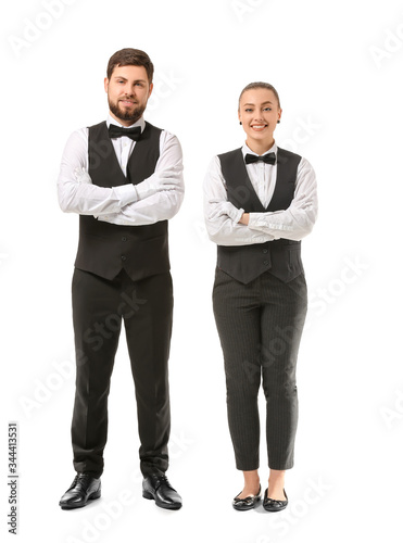 Male and female waiters on ...