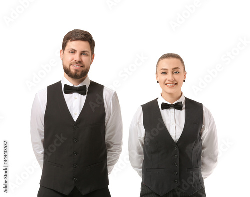 Male and female waiters on ...
