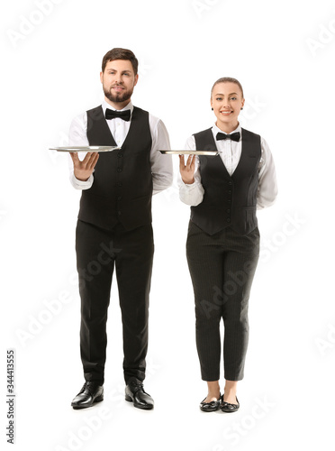 Male and female waiters on ...