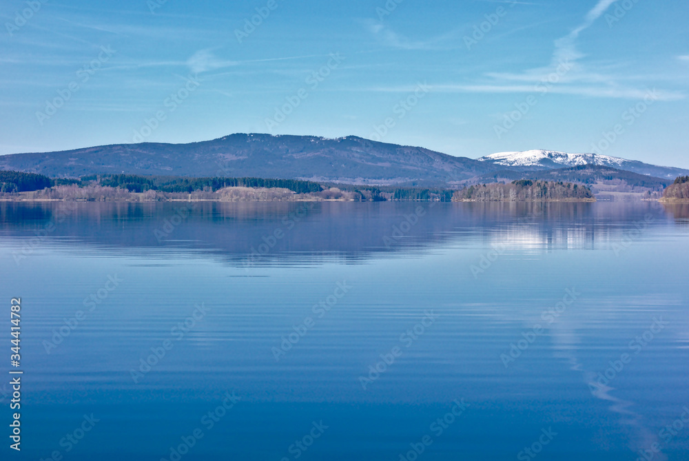 Lake with mountains in the background and water reflection, landscape 
