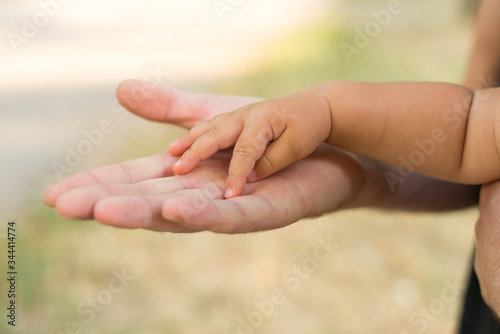 Father holding his daughter's hand. © Nastya