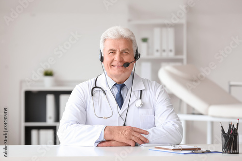 Male doctor giving a consul...