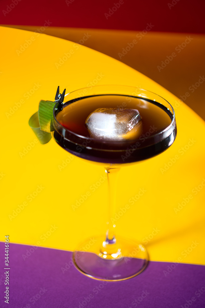 top view on the alcohol cocktail on the colorful background