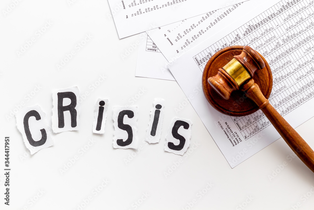 Financial crisis concept with gavel - debt, bankruptcy - on white background top view