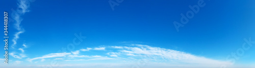 Blue Sky background with tiny Clouds. Panorama background