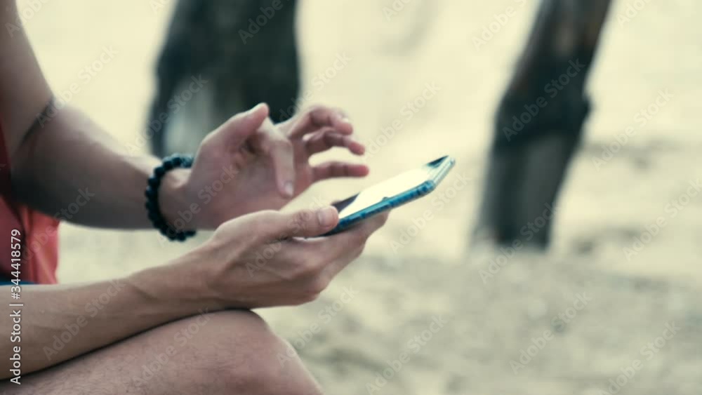 Scene slow motion hand of man is using smartphone Scene slow motion hand of man is using smartphone