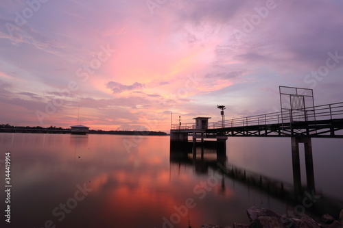 Dokkrai Reservoir and view sunset water reflection at rayong, thailand  © pantkmutt