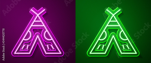 Glowing neon line Traditional indian teepee or wigwam icon isolated on purple and green background. Indian tent. Vector Illustration