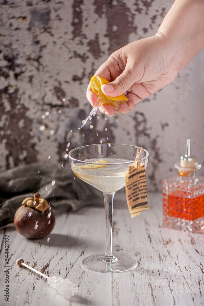 Cocktail and mixology. Glass of сocktail. Hand of barman. Cocktail and mixology. Glass of сocktail. Hand of barman.