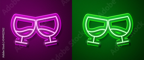 Glowing neon line Glass of cognac or brandy icon isolated on purple and green background. Vector Illustration