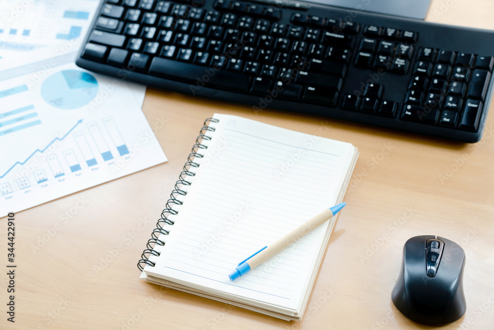 Close up Computer Keyboard and Mouse , Pencil and Graphing Notebook on Top of Wooden Desk Close up Computer Keyboard and Mouse , Pencil and Graphing Notebook on Top of Wooden Desk