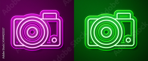 Glowing neon line Photo camera icon isolated on purple and green background. Foto camera icon. Vector Illustration