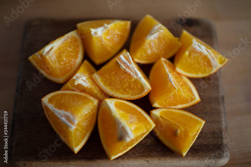 juicy beautiful slices of oranges on a wooden board