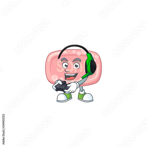 A cartoon design of pink soap talented gamer play with headphone and controller