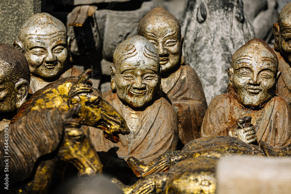 Fototapeta premium Statues of the gods of Asia, close-up