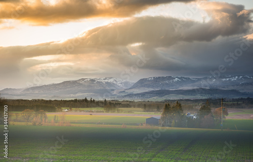 Stormy sky over Crieff in Perth and Kinross, Scotland. Beautiful Scottish countryside landscape in foreground. photo