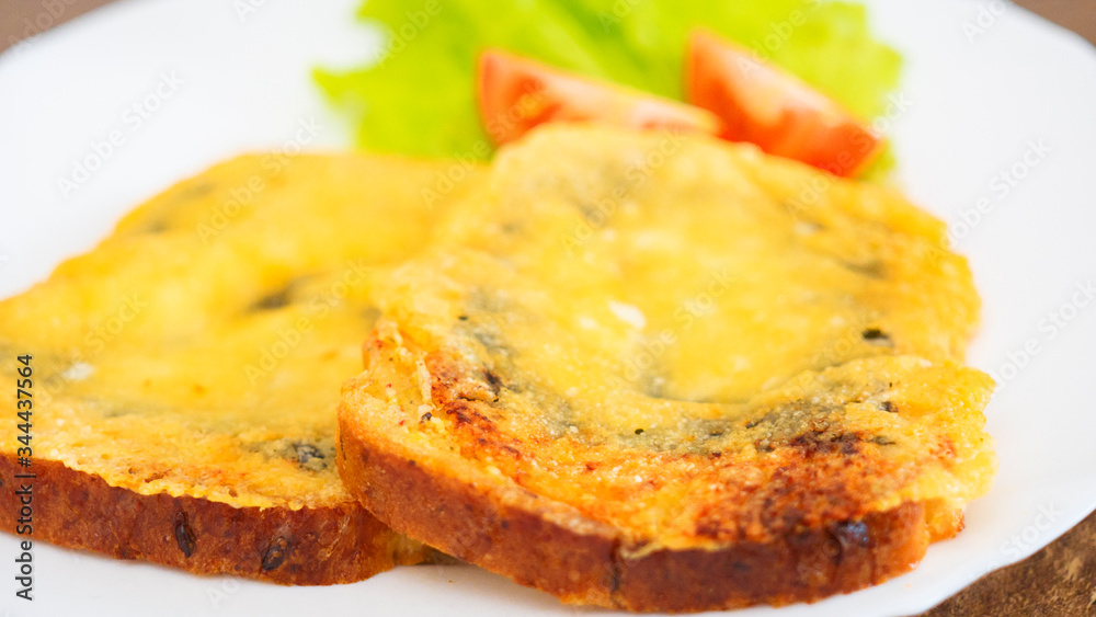 sandwiches baked with cheese with Salad and tomato on the plate sandwiches baked with cheese with Salad and tomato on the plate