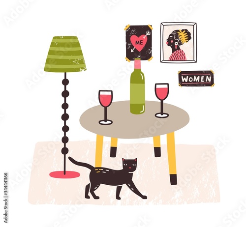 Comfy interior with cat, table with bottle and glasses on it and posters on t...