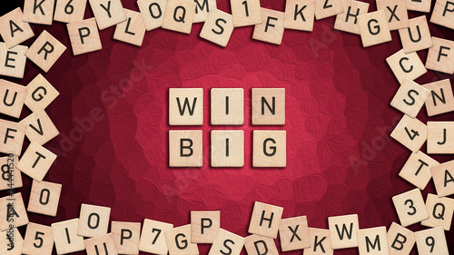 Win Big written with wooden tiles over red background.