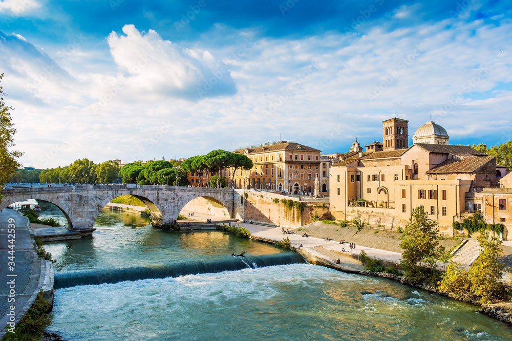 Beautiful river and stone bridge view in Rome. The Pons Cestius is a Roman stone bridge in Rome, Italy