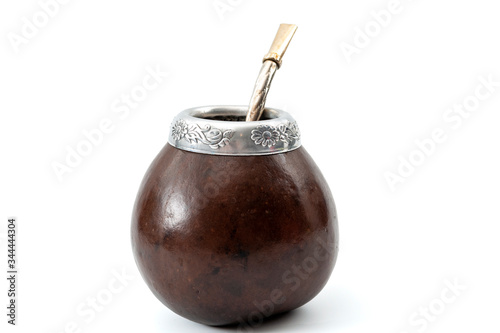 Nootropic stimulant, alternative medicine and holistic cleanse concept with gourd and bombilla (metallic drinking straw) for yerba mate tea isolated on white background with clipping path cutout