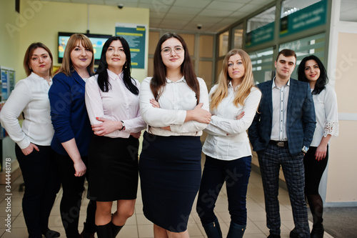 Portrait of young business people group of bank workers in modern office.