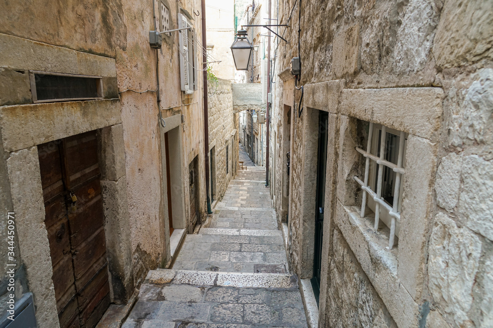 Narrow streets in the form of stairs, paved with stone in the city of Dubrovnik