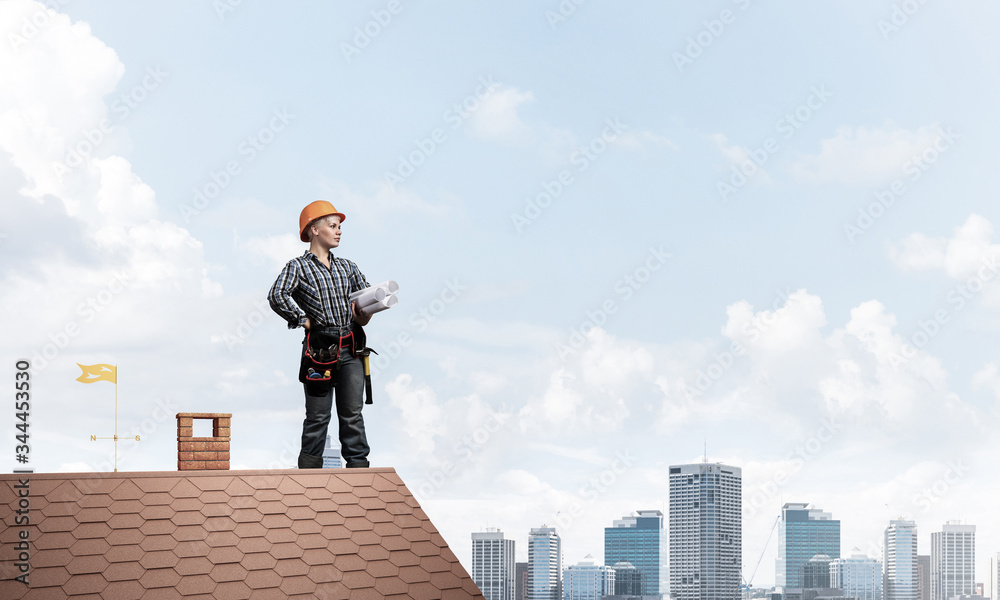 Builder in hardhat with technical blueprints Builder in hardhat with technical blueprints
