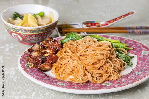 Wanton noodle with barbecue pork, vegetable and dumpling, popular Chinese food.